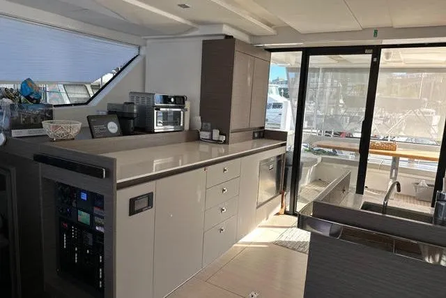 Hamlet Yacht Photos Pics Modern kitchen interior on 2023 Leopard 46PC yacht, featuring sleek cabinetry and appliances.
