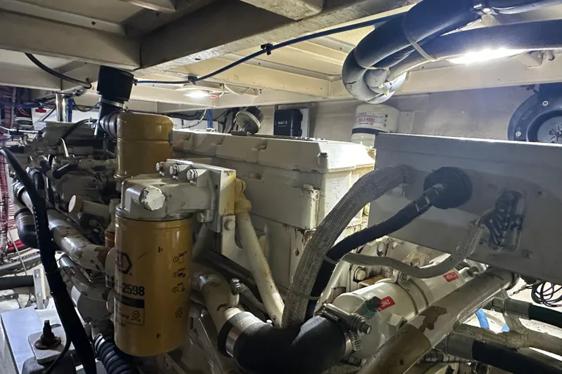 Chief Yacht Photos Pics Engine room of 2000 Grand Banks 43 Eastbay FB, showcasing mechanical components and wiring.