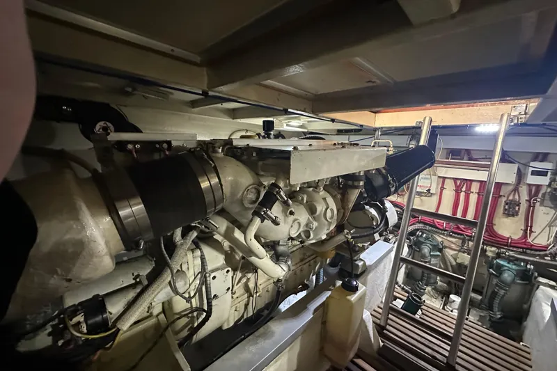 Chief Yacht Photos Pics Engine room of 2000 Grand Banks 43 Eastbay FB with visible machinery and ladder.
