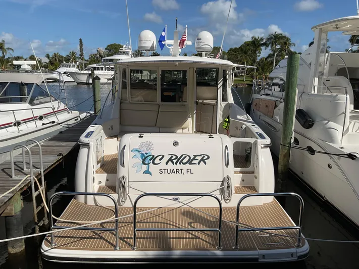 Cc Rider Yacht Photos Pics 2004 Tiara Yachts 4400 Sovran docked in marina, rear view.