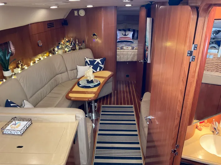 Cc Rider Yacht Photos Pics Luxurious 2004 Tiara Yachts 4400 Sovran interior with cozy seating and elegant decor.