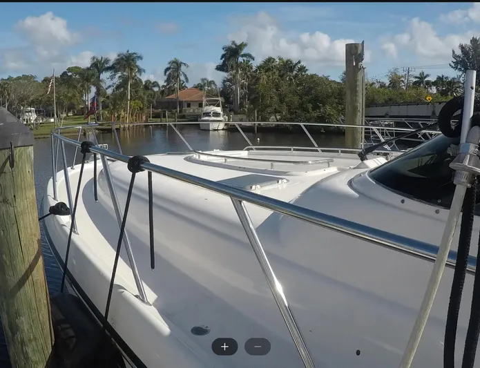 Cc Rider Yacht Photos Pics 2004 Tiara Yachts 4400 Sovran docked in a scenic marina setting.