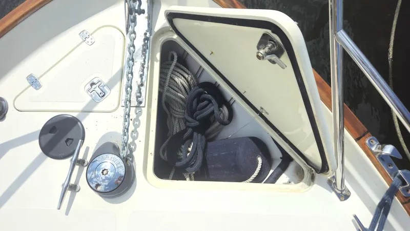 Odyssey III Yacht Photos Pics Open storage compartment on 2008 Legacy 32 boat deck with ropes and equipment.