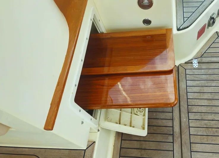 Odyssey III Yacht Photos Pics Wooden steps on a 2008 Legacy 32 boat, featuring polished finish and deck details.