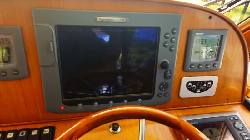 Odyssey III Yacht Photos Pics Boat dashboard with navigation screens and controls, Legacy 32 model, 2008.