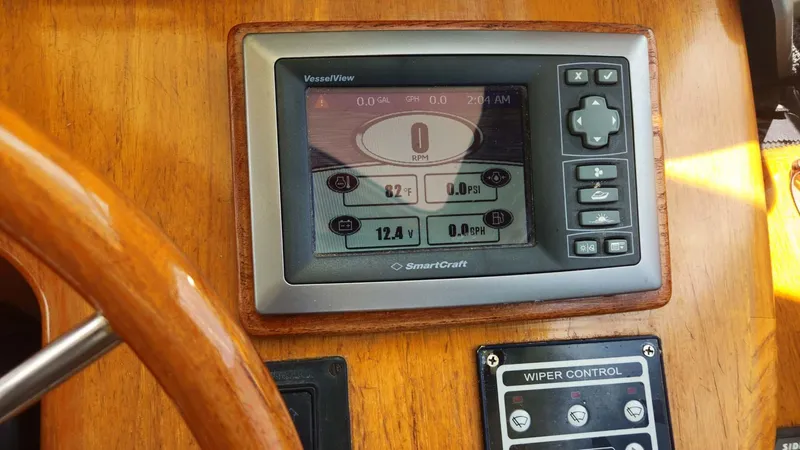 Odyssey III Yacht Photos Pics SmartCraft VesselView display on 2008 Legacy 32 boat dashboard with wiper control panel.