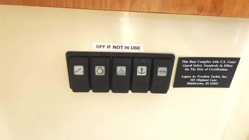 Odyssey III Yacht Photos Pics Control panel with labeled switches on a 2008 Legacy 32 boat.