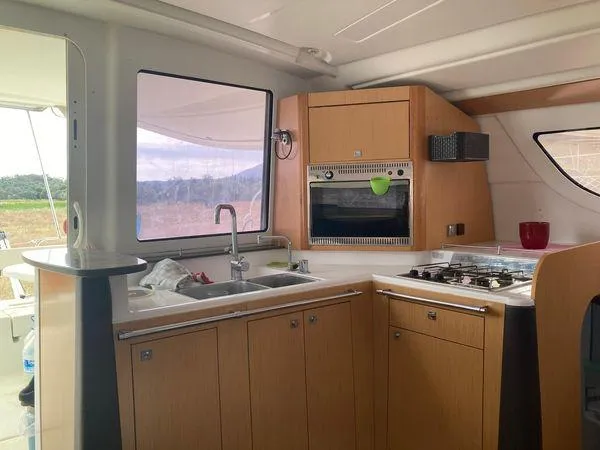  Yacht Photos Pics Interior kitchen of 2011 Fountaine Pajot Lipari 41 catamaran with stove and sink.