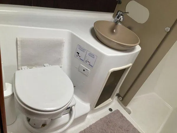  Yacht Photos Pics Bathroom interior of 2011 Fountaine Pajot Lipari 41 catamaran, featuring toilet and sink.