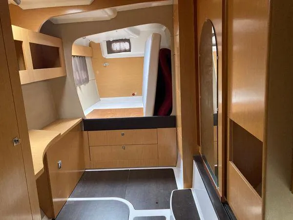  Yacht Photos Pics Interior of 2011 Fountaine Pajot Lipari 41 catamaran, featuring wood cabinetry and modern design.