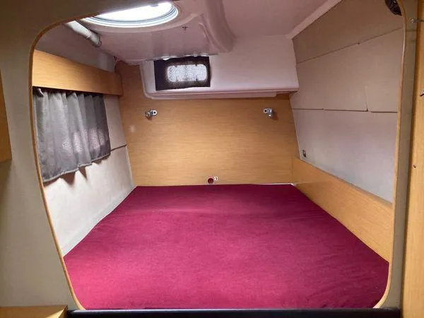  Yacht Photos Pics Interior cabin of 2011 Fountaine Pajot Lipari 41 catamaran with red bedding.