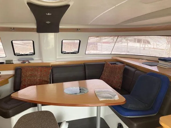  Yacht Photos Pics Interior of 2011 Fountaine Pajot Lipari 41 catamaran with cozy seating and table.