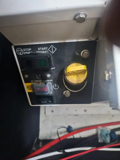  Yacht Photos Pics Control panel of a 2011 Fountaine Pajot Lipari 41 catamaran with start and stop buttons.