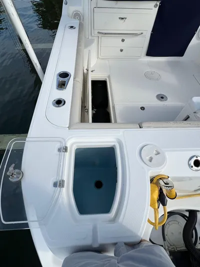  Yacht Photos Pics 2016 Boston Whaler 315 Conquest boat interior with storage and seating.