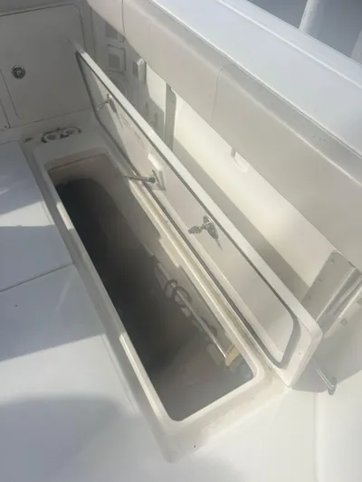  Yacht Photos Pics Open storage compartment on 2016 Boston Whaler 315 Conquest boat.