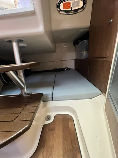  Yacht Photos Pics Interior cabin of 2016 Boston Whaler 315 Conquest with wooden flooring and seating.