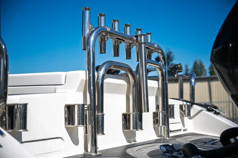  Yacht Photos Pics 1990 Boston Whaler 31 Offshore Custom Conquest boat with stainless steel rod holders.