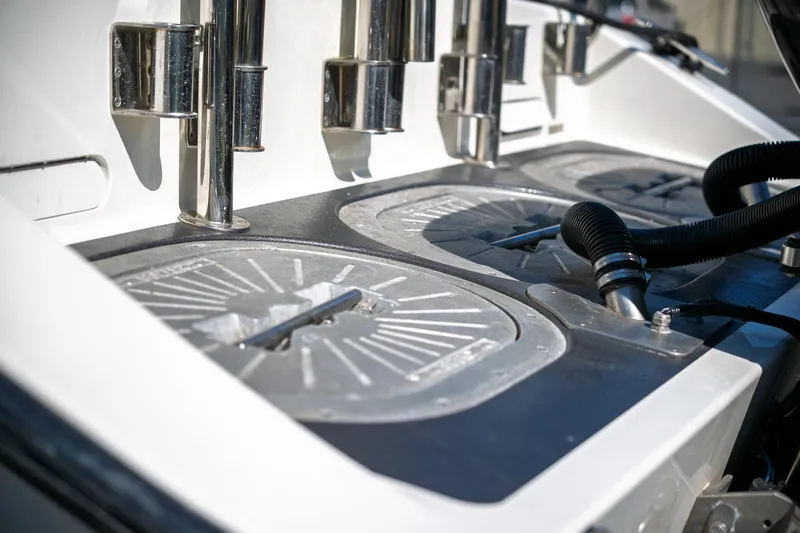  Yacht Photos Pics 1990 Boston Whaler 31 Offshore Custom Conquest deck with fishing rod holders.