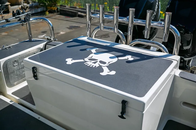  Yacht Photos Pics 1990 Boston Whaler 31 Offshore Custom Conquest with skull and crossbones design on deck.