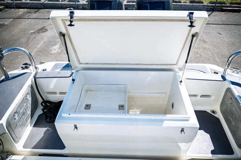  Yacht Photos Pics Open storage compartment on 1990 Boston Whaler 31 Offshore Custom Conquest boat.