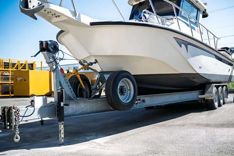  Yacht Photos Pics 1990 Boston Whaler 31 Offshore Custom Conquest on trailer, ready for transport.