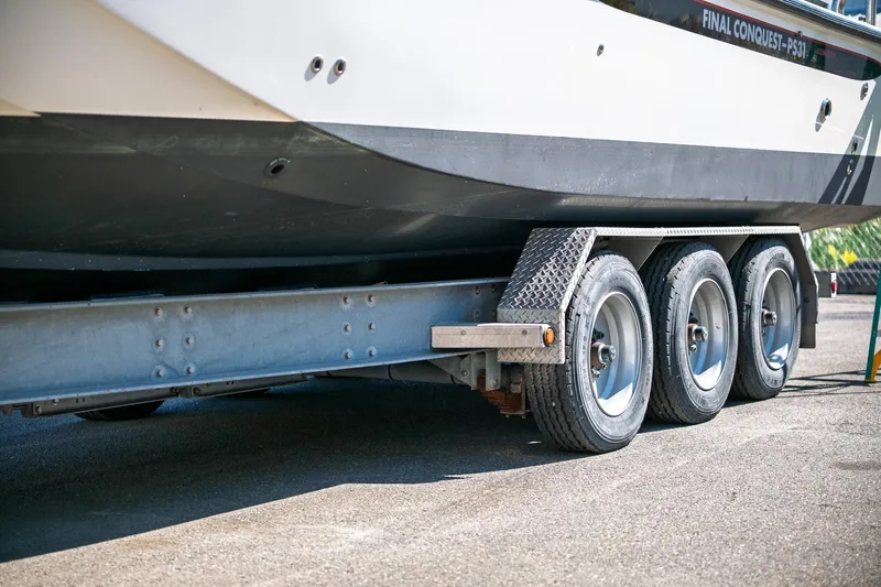  Yacht Photos Pics 1990 Boston Whaler 31 Offshore Custom Conquest on a triple-axle trailer.