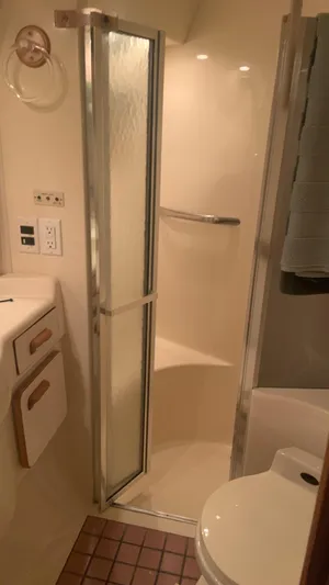 Amusement Yacht Photos Pics Bathroom interior of 1994 Sea Ray 500 Sundancer yacht, featuring shower and sink.
