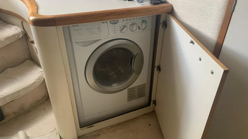 Amusement Yacht Photos Pics Washing machine inside 1994 Sea Ray 500 Sundancer yacht cabinet.