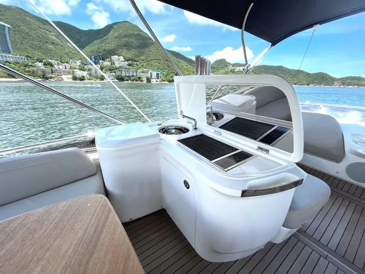  Yacht Photos Pics Luxury yacht Princess F45 2020 model with outdoor kitchen, scenic coastal view.