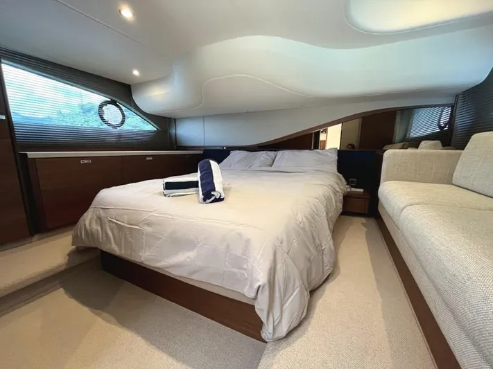  Yacht Photos Pics Luxurious bedroom interior of 2020 Princess F45 yacht with modern design and cozy bedding.
