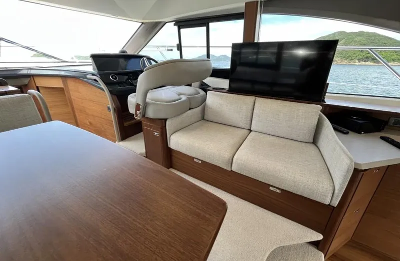  Yacht Photos Pics Luxurious interior of 2020 Princess F45 yacht with modern seating and large windows.