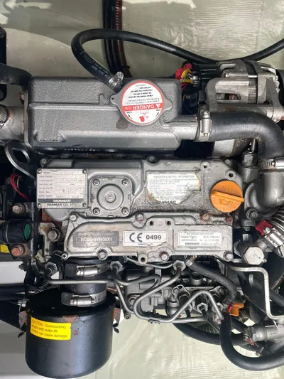 Morning Star Yacht Photos Pics Engine of a 2021 Leopard 40 boat, featuring Yanmar components and warning labels.