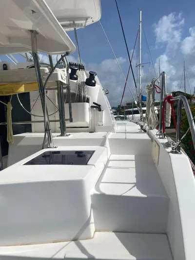 Morning Star Yacht Photos Pics 2021 Leopard 40 catamaran deck with rigging, docked under clear blue sky.