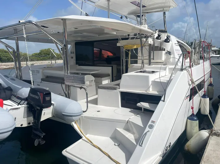 Morning Star Yacht Photos Pics Leopard 40 catamaran, 2021 model, docked with inflatable boat and Tohatsu motor.