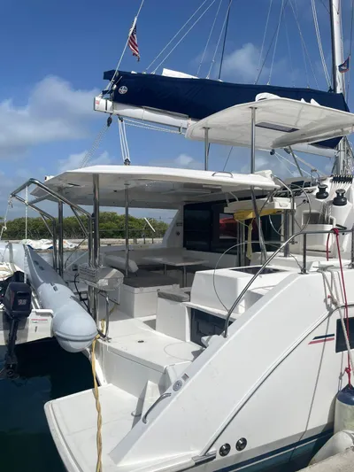 Morning Star Yacht Photos Pics 2021 Leopard 40 catamaran docked, featuring spacious deck and modern design under clear skies.