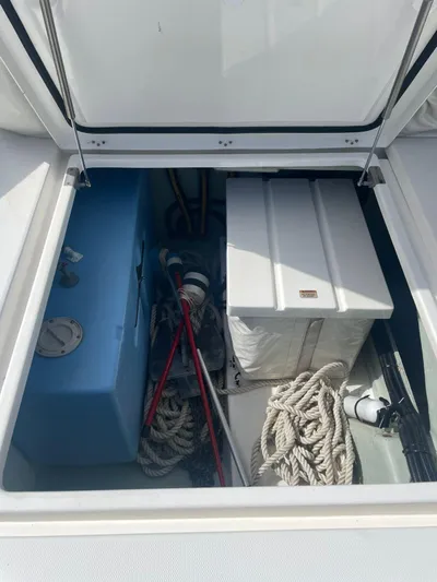 Morning Star Yacht Photos Pics Storage compartment on a 2021 Leopard 40 boat with ropes and equipment.