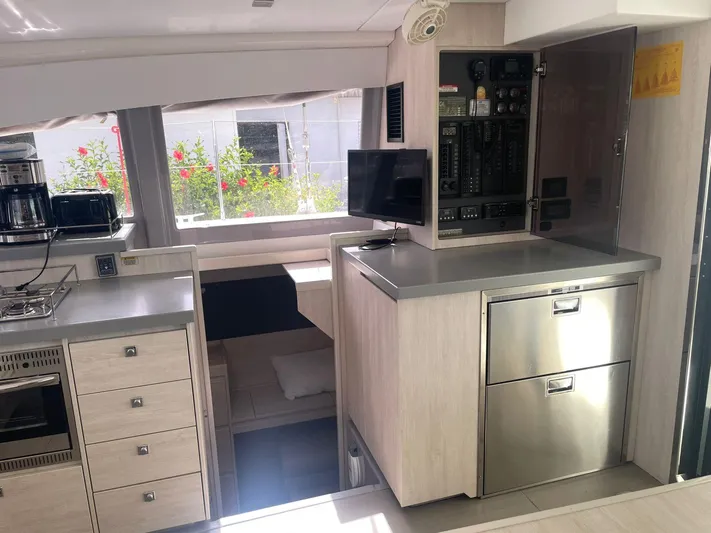 Morning Star Yacht Photos Pics Modern kitchen interior of 2021 Leopard 40 yacht with appliances and control panel.