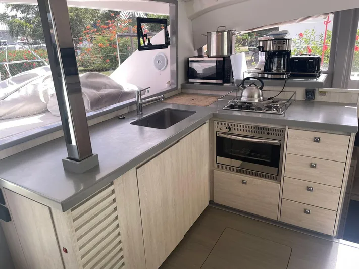 Morning Star Yacht Photos Pics Modern kitchen in a 2021 Leopard 40 catamaran with appliances and sleek countertops.