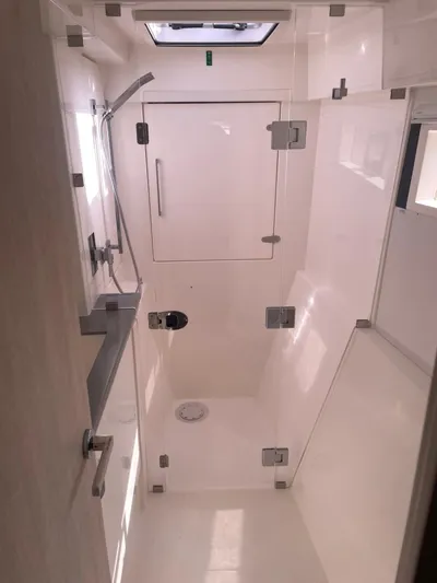 Morning Star Yacht Photos Pics Modern shower area in a 2021 Leopard 40 catamaran, featuring sleek design and fixtures.