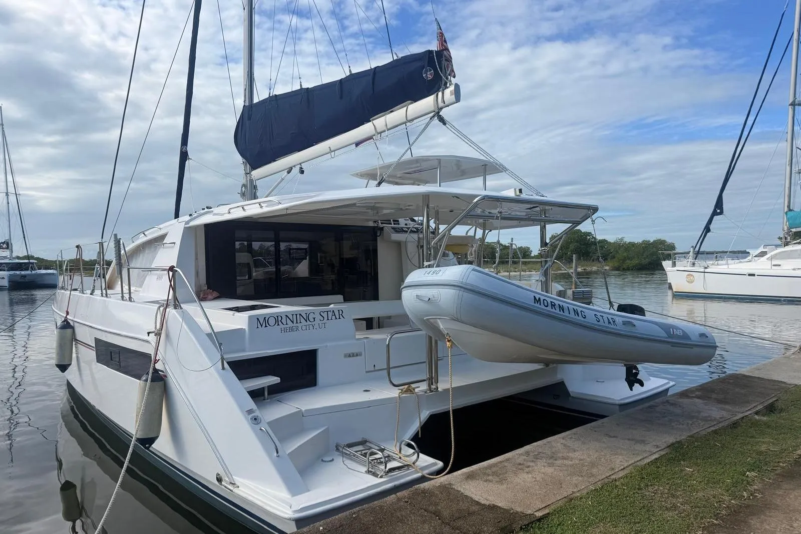 Leopard 40 catamaran, 2021 model, docked with dinghy, named "Morning Star."