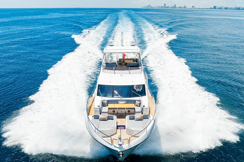  Yacht Photos Pics 2021 Sunseeker 76 Yacht cruising on open sea, leaving a wake behind.