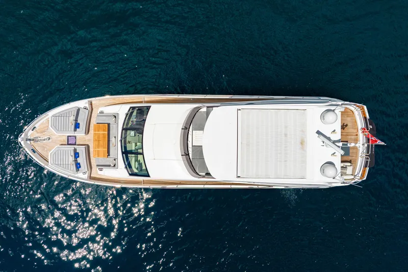 Yacht Photos Pics Overhead view of 2021 Sunseeker 76 Yacht on deep blue water.