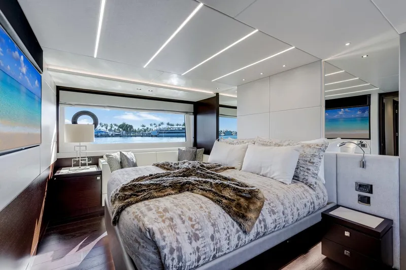  Yacht Photos Pics Luxurious bedroom interior of 2021 Sunseeker 76 Yacht with scenic ocean view.