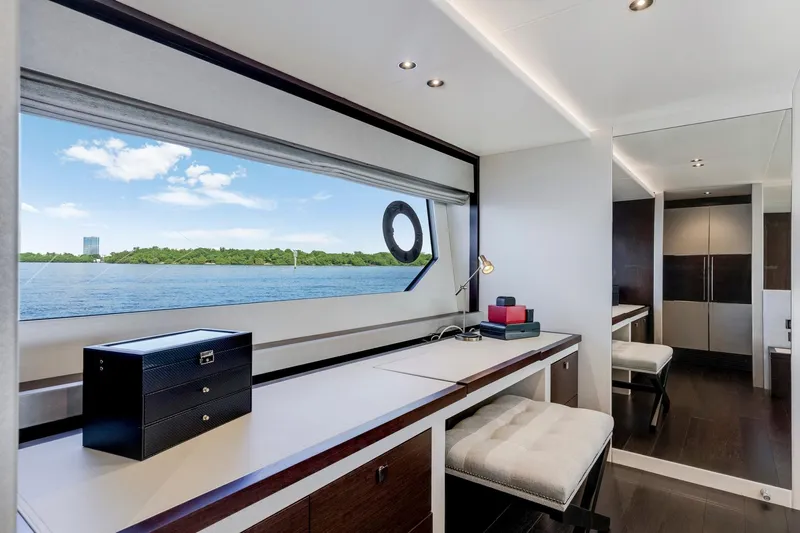  Yacht Photos Pics Luxurious interior of 2021 Sunseeker 76 Yacht with scenic ocean view through large window.