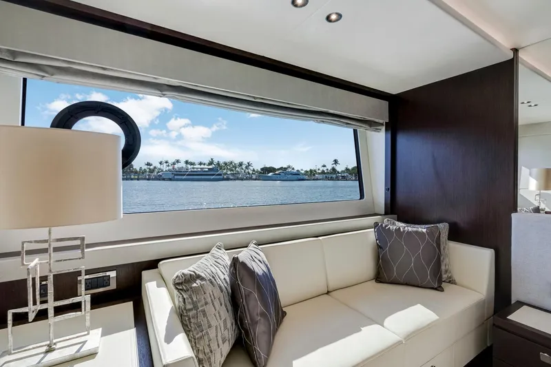  Yacht Photos Pics Luxurious interior of 2021 Sunseeker 76 Yacht with scenic ocean view through large window.