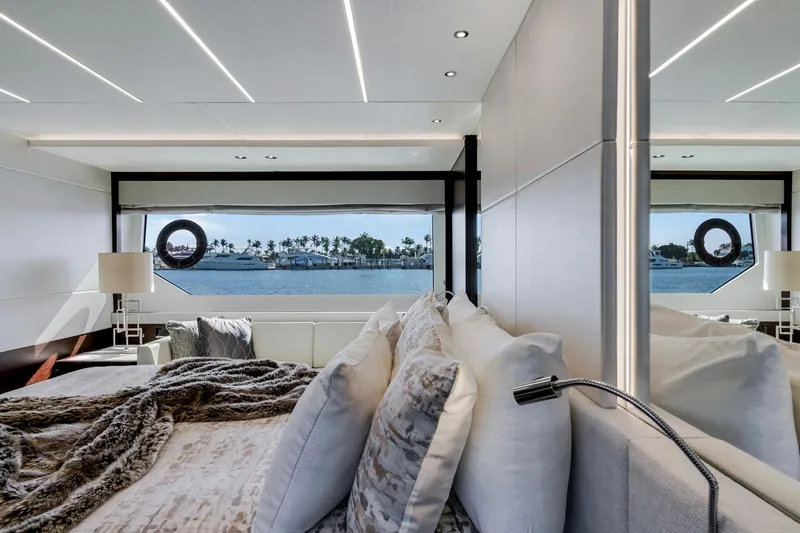  Yacht Photos Pics Luxurious interior of 2021 Sunseeker 76 Yacht with waterfront view through large windows.