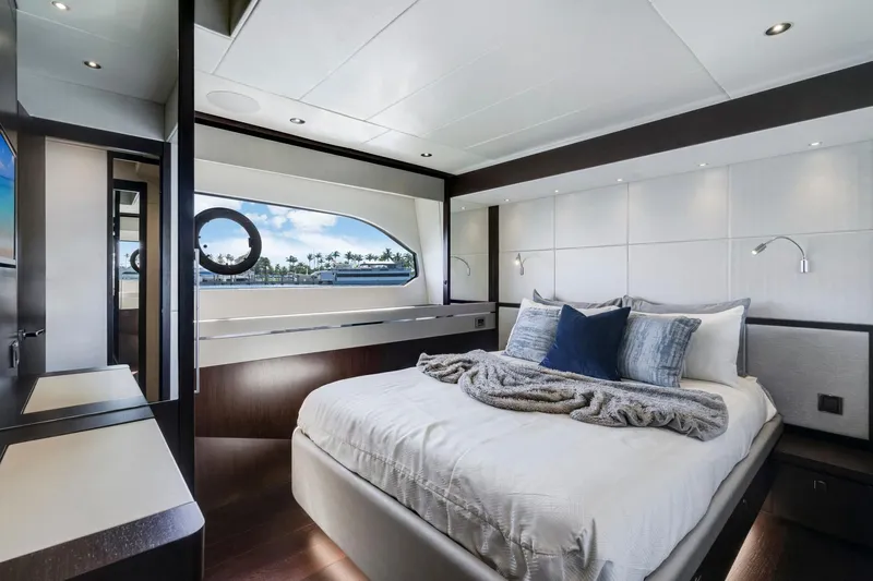  Yacht Photos Pics Luxurious bedroom interior of 2021 Sunseeker 76 Yacht with modern design and ocean view.