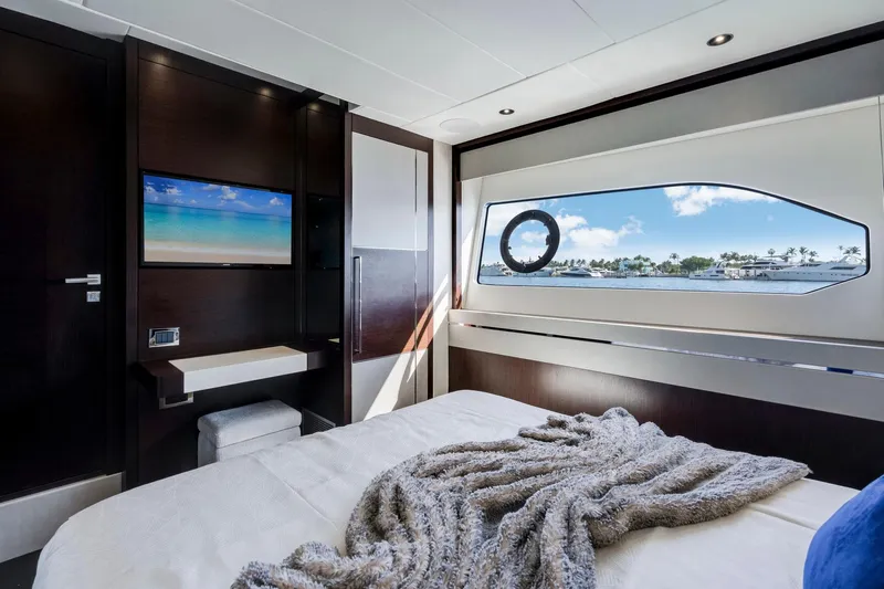  Yacht Photos Pics Luxurious Sunseeker 76 Yacht 2021 bedroom with ocean view and modern amenities.
