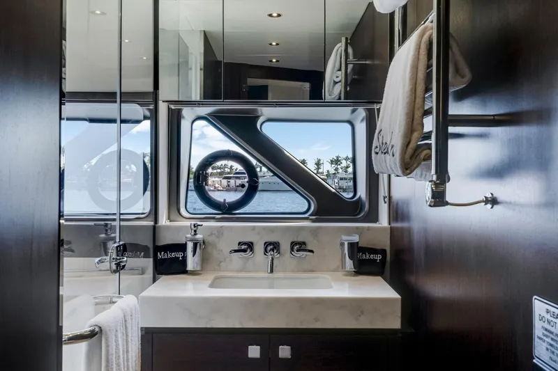  Yacht Photos Pics Luxurious bathroom interior of 2021 Sunseeker 76 Yacht with ocean view window.
