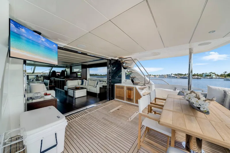  Yacht Photos Pics Luxurious 2021 Sunseeker 76 Yacht interior with elegant seating, dining area, and scenic water view.